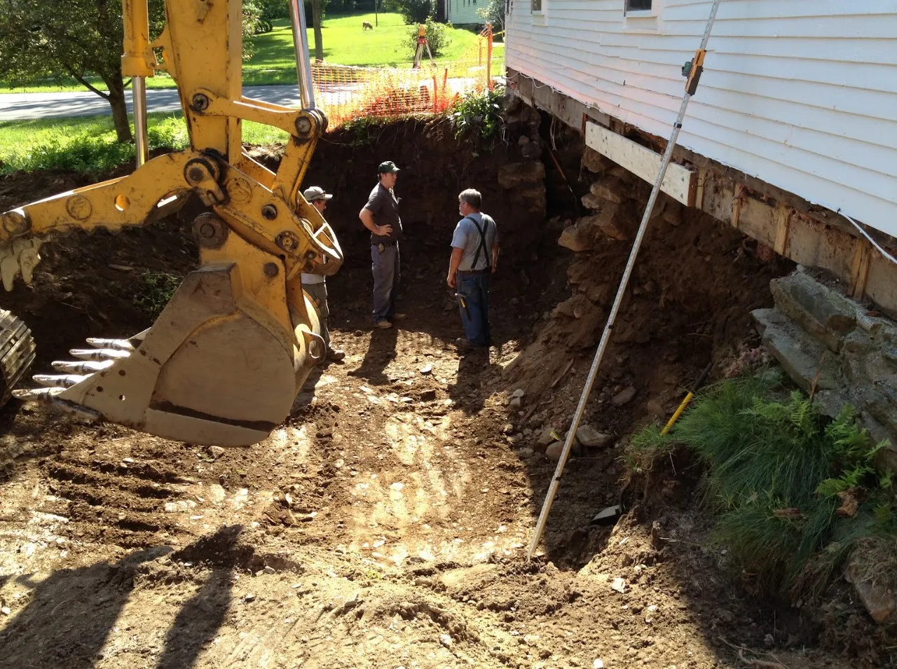 Excavation work underway during a foundation repair project