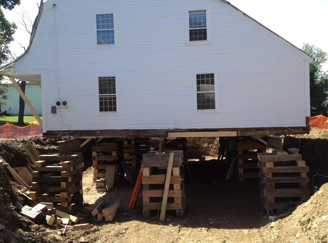 Backfill and repair work nearing completion on a residential foundation