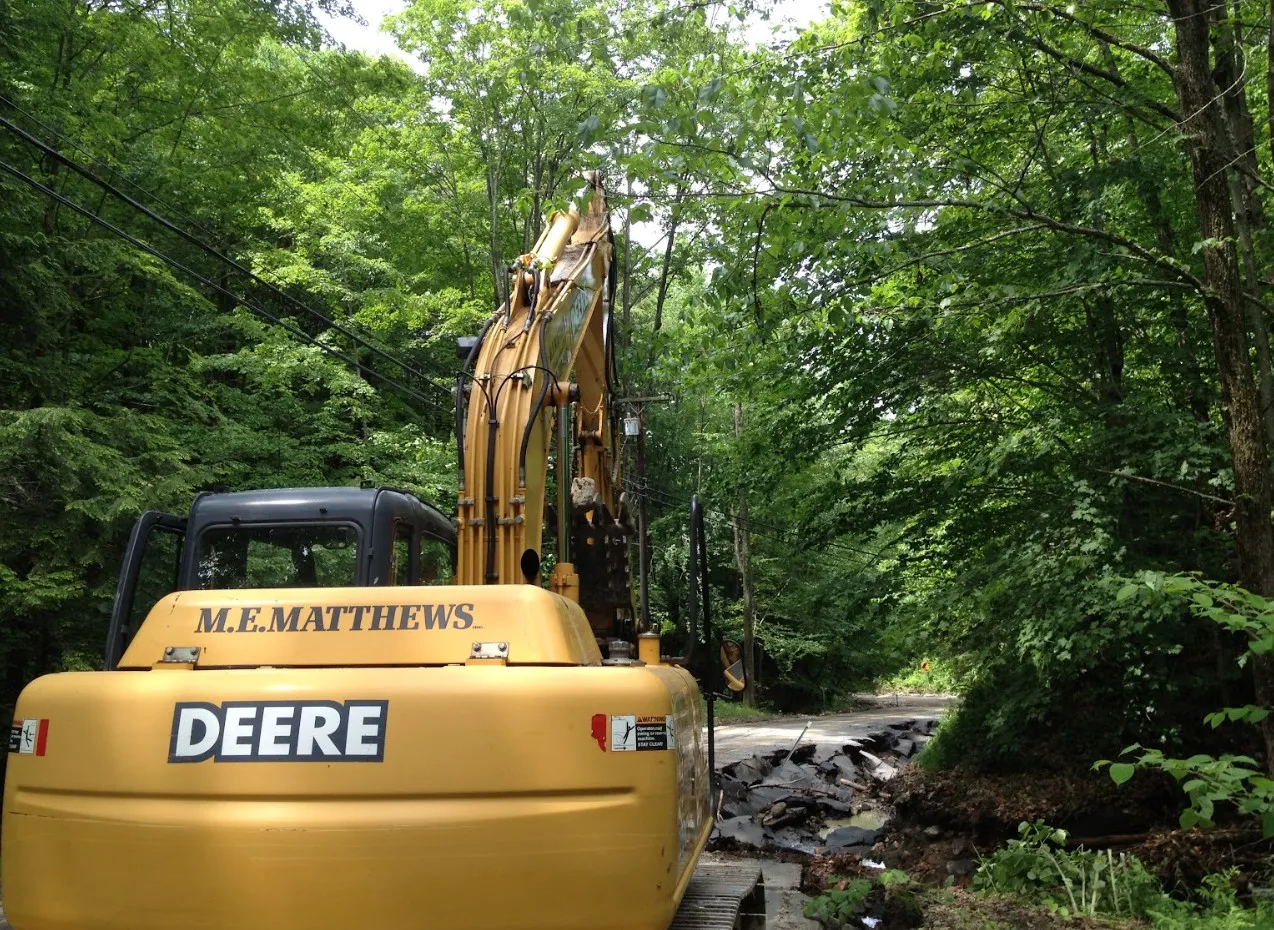Base gravel and drainage work along a new road route